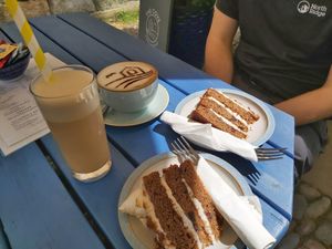 Vegan banana, walnut and toffee cake with an oat milk iced coffee, delicious 😋 at The Cove in Robin Hoods Bay