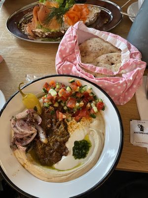 Hummus with pita  at NENI in Vienna