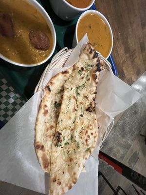 Garlic nan, plant based chicken tikka Masala  at Tulsi Indian Eatery in Los Angeles