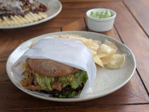 Lentil burger with chips and vegan mayo at Gracias Vida in La Guajira