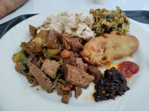 Seitan, tofu, fried berenjena and veggie ball. Def get the complimentary sauce! at Loving Hut in Panama City