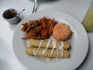 Tacos dorado, con sus guarniciones at Loving Hut - Xalapa in Xalapa