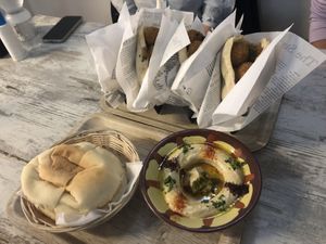 panini falafel e hummus con pita da dividere, buonissimo!  at Atomic Falafel in Florence