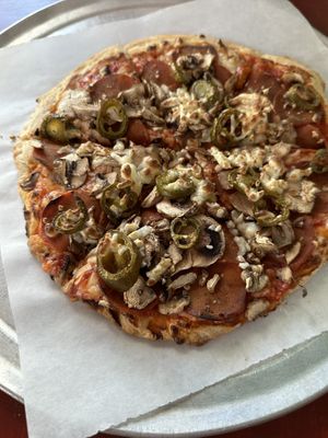 Pepperoni mushroom jalapeño vegan cheese pizza. Super thin    at Lanesplitter Pizza in Emeryville