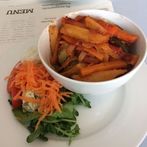 Jacket potato with a 'scoop of main meal' (daily special). Served with salad. at The Kitchen on Great Moor Street in Bolton
