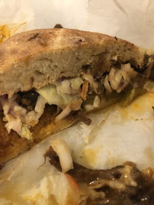 Delicious pulled pork made of mushrooms and topped with bbq, coleslaw and pickles.   So good!!  at GRASS fed in Rochester