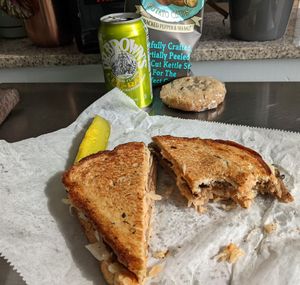 Reuben cookie combo with a drink, chips, a pickle and a cookie at GRASS fed in Rochester