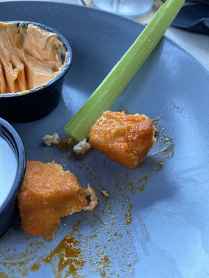 Tofu bites came with celery. Small portion. Maybe 7 squares. Came with vegan ranch.   at Sage Karma Kitchen in Willoughby