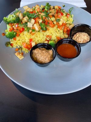 Thai Dye Bowl with tofu added, and peanuts, siracha, and peanut sauce on the side.  at Sage Karma Kitchen in Willoughby