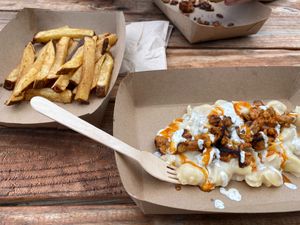 Buffalo chickn Mac n cheese bowl with seasoned fries  at Plantology in Gainesville
