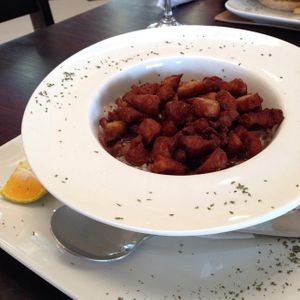 Chifrijo: veggie version of the typical chifrijo: rice, beans, pico de gallo, avocado, tortilla chips topped with soy chicarron. Very tasty and filling.  at Veggie House in San Jose