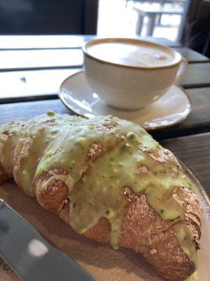 Pistachio croissant and coffee at Revival in West London