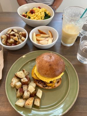 Breakfast bowl and a sausage, egg, and cheese with a side of potatoes and fruit at Earthly Cafe in Somers Point