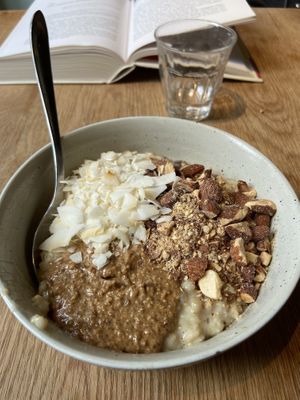 Vegan porridge with almundbutter, coco and almunds 😍  at GRØD - Birkegade in Copenhagen