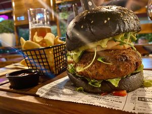 Poppea burger with zucchini falafel, fried onion rings, guacamole sauce, lettuce  at Agrippina Street Food in Pula