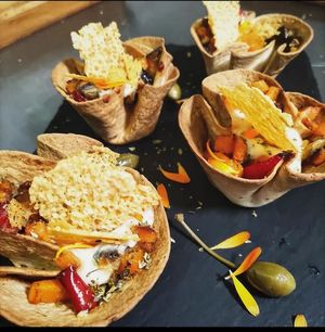 Nidos rellenos de verduras de temporada, y queso parmesano vegano at Bar Caleya Indi in Colunga