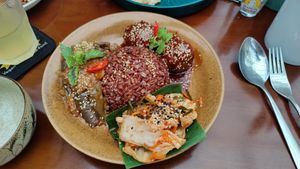 Red rice, eggplant stew, tofu balls and kimchi at Peanuts in Hoi An