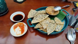 Rice crackers and a sample of peanut stew at Peanuts in Hoi An