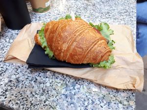 Salty croissant with salad, grilled aubergine and tomatoes at Il Pane Quotidiano Lungomare in Trieste