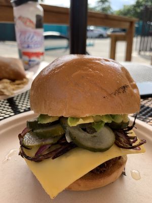 Homemade Patty, pickles, + pina bun😍   at Moksha in Rincon