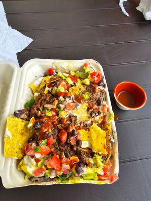 Nachos supreme with hot sauce at Moksha in Rincon