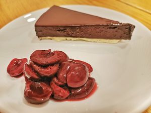 Tarta de chocolate y caramelo con cerezas al patxaran at Orburu Taberna in San Sebastian