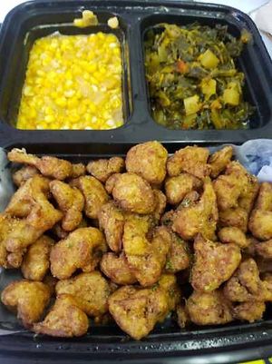 Fried cauliflower, creole greens, creamed corn   at Meals that Heal in Jackson