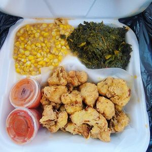 Cauliflower Wings, kale, corn at Meals that Heal in Jackson