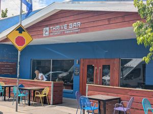 Exterior with patio seating at Alua's Thrive Bar in Mount Shasta