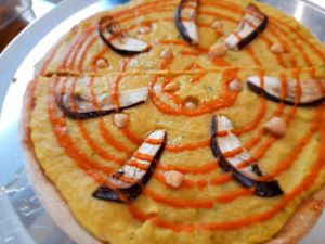 La del huerto. Hummus, eggplant with harisa sauce  at Vegan Pizzeria in San Juan