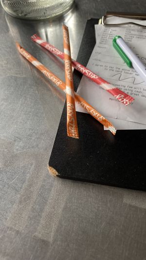 Pixie sticks come with the check!  at Daily Planet in Burlington