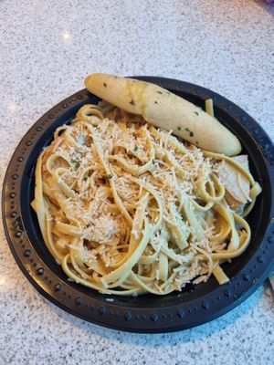 Pasta Alfredo with vegan chicken and vegan Parmesan at Cafe 4 in Orlando