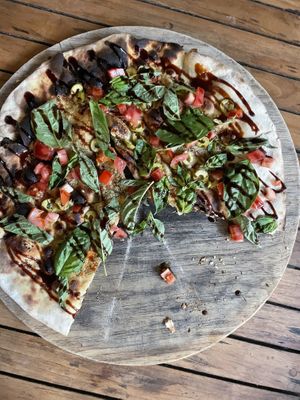 La Luna house flatbread ordered without pesto (not vegan) sub fresh basil leaves at La Luna in Nosara