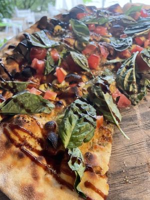 La Luna house flatbread ordered without pesto (not vegan) sub fresh basil leaves at La Luna in Nosara