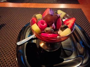 Fresh fruit, chocolate sauce, cream sauce, raspberry ice cream at Espaço Vivo S Coop Galega in Redondela