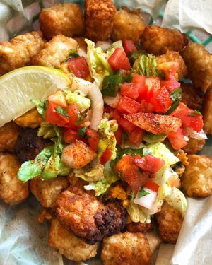 Tater tot nachos with a homemade vegan “nacho cheese" at Kayak Kafe - Broughton in Savannah