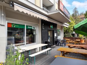Outdoor seating in the front at L'Imprevu Cafe in Fribourg