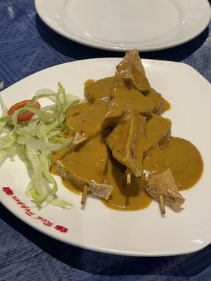 Tofu skewers satay sauce   at Woks Bar and Restaurant in Brandon