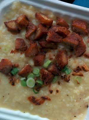 Lugaw: A hearty rice soup cooked in vegetable broth and ginger with fried soy chicken strips. Soup for the soul! at No Worries Cuisine in Oakland