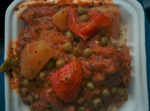 Apritada: A stew-like combination of soy chicken, potatoes, red bell peppers and green peas melted into a tomato based sauce. at No Worries Cuisine in Oakland