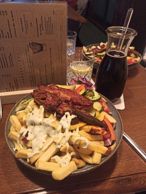 Very good kirschschorle (the red beverage), but unsure if the dressing in the bowl wochenedition (which means weekly edition) was vegan as the menu was only in German. at Landwehr - Bräu am Turm in Rothenburg Ob Der Tauber