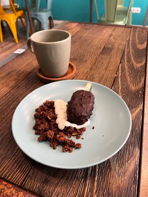 "Minium" -cashew ice cream with berries compote covered chocolate glaze with almonds at El Med Veg in Tenerife