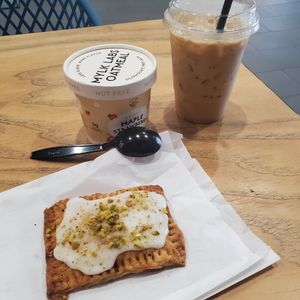 Cherry pistachio pop tart and caramel latte. at Cartel Coffee Lab - Downtown Phoenix in Phoenix