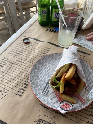 Falafel pitta & menu on table  at Ya Mas in Vlore