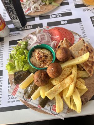 Vegan platter with falafel and hummus. The vegetarian platter has tzatziki and halloumi     at Ya Mas in Vlore