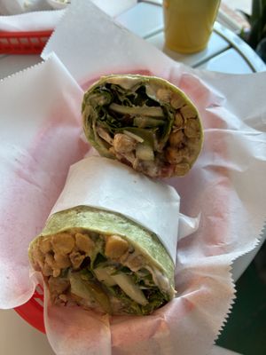 Chickpea shawarma wrap and a vampire slayer juice in the background   at Juicy's Wellness Cafe in Cookeville