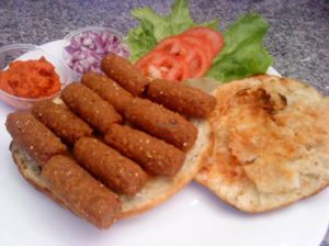 Vegan soy chevaps (meat) + bread + sauces at Prasadam in Zagreb