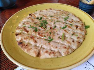 Garlic bread with the curry (May 2024) at Lounges - Athro Lounge in Aberystwyth
