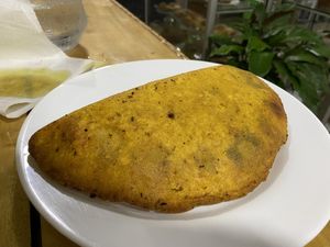 Vegan empanada filled with refried beans  at Cafe la Semilla in Bijagua