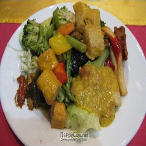 Plate of food with selections from Asian and Indian vegetarian buffet at Golden Kinnaree Buffet Restaurant in Phuket